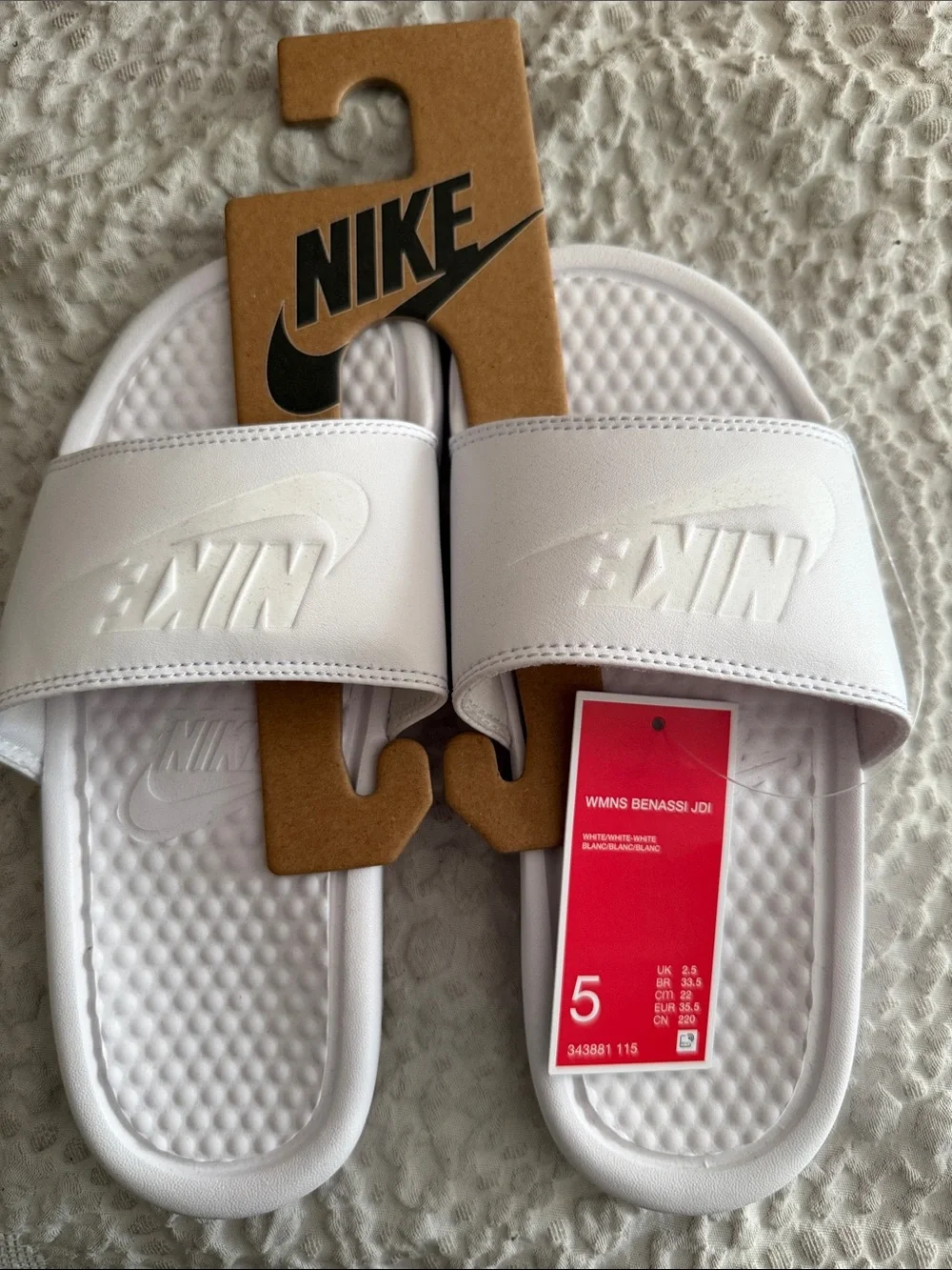 Nike White Kids Slide Sandals with Embossed Logo